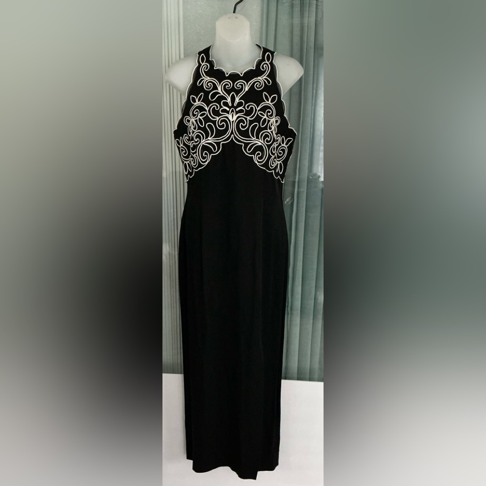 Scott McClintock black sleeveless maxi dress with white embroidered
detailing.